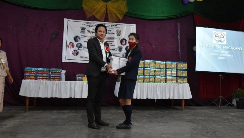 EAC (Sadar), Kohima Kevingoto Kulnu, NCS giving away the study materials under Vigyan Jyoti Scheme at Jawahar Navodaya Vidyalaya, Kohima on March 13. (DIPR Photo) 